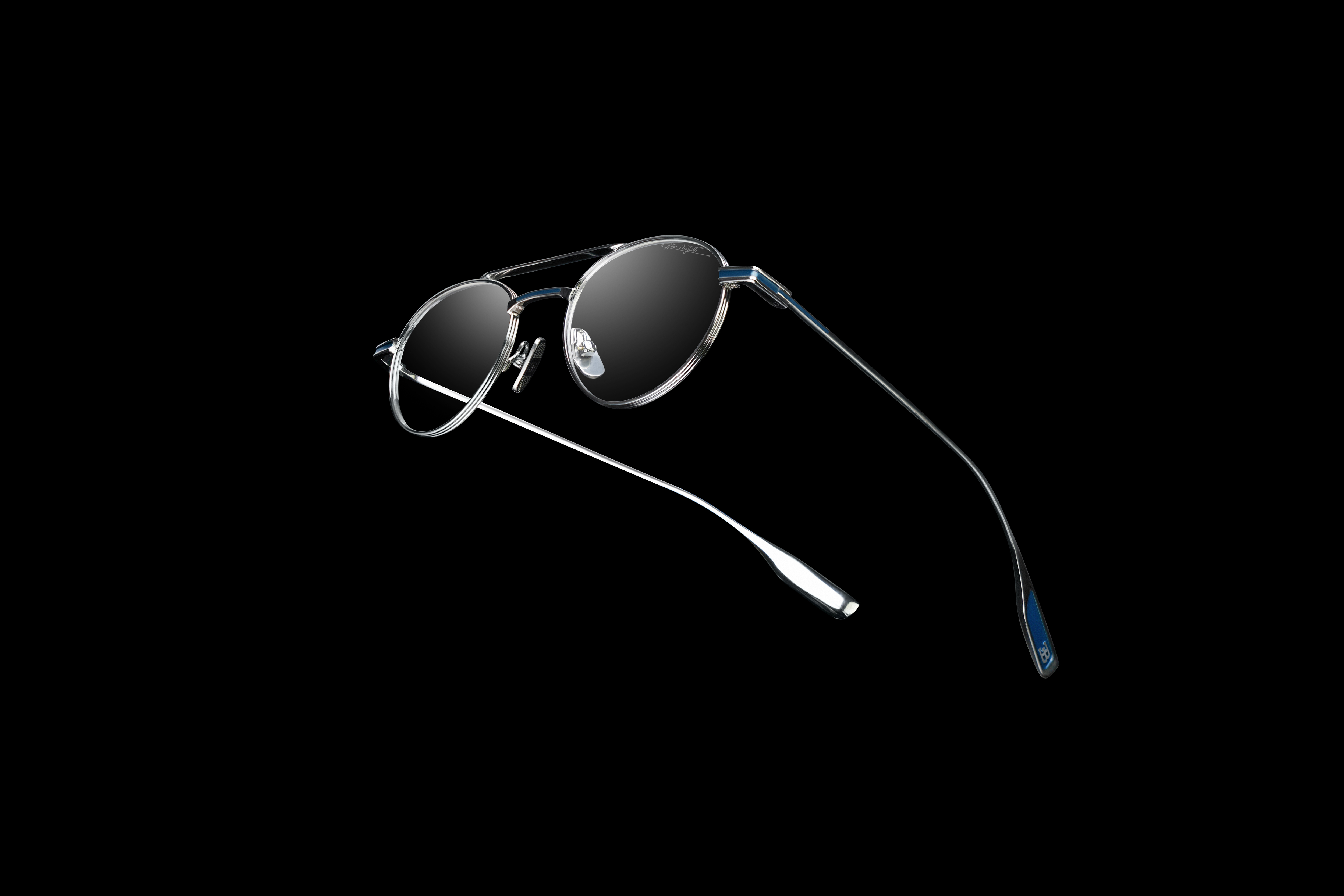 Model 56 distills Bugatti Eyewear’s design philosophy to its purest form – an ultra-light, all-titanium round frame that showcases material precision, technical mastery and understated elegance.